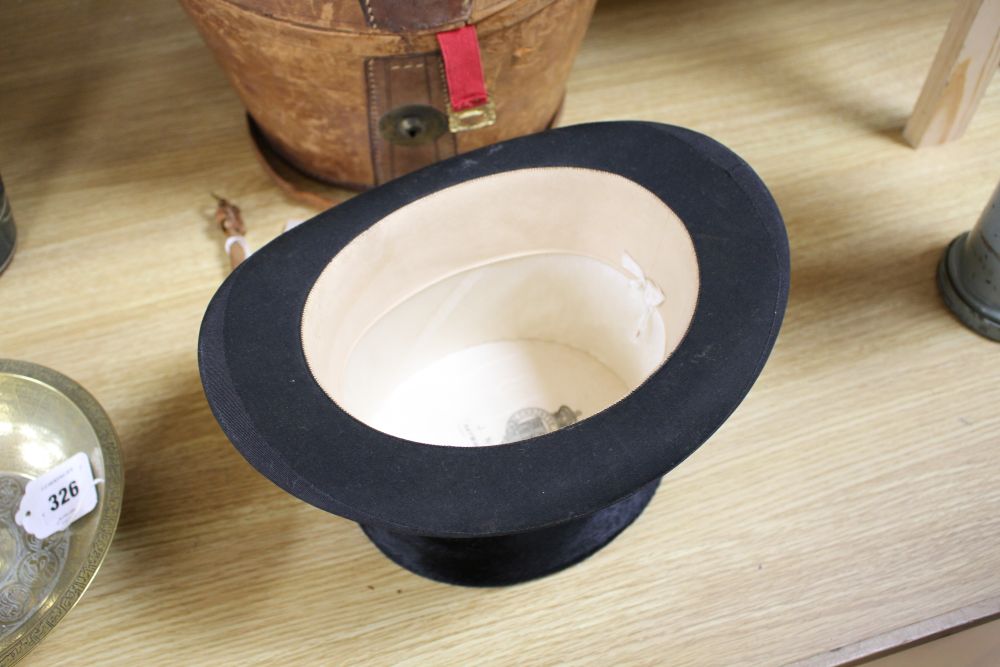 A moleskin top hat in a leather box by Christys London, J. Norton, Haywards Heath, Internal dimensions 15 x 19cm